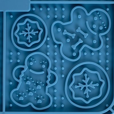Silikonmatta med former för hundgodis: snöflinga, pepparkaksgubbe och benmotiv. Lämplig för att göra godis eller snacks.