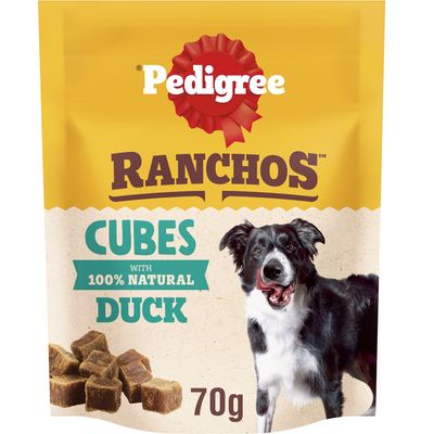 Cubes with 100% natural duck, 70g. Image shows product cubes and a dog beside the text.
