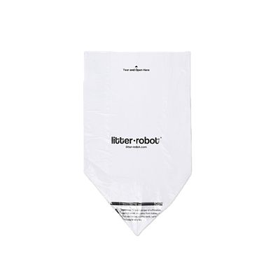 Sac en plastique blanc avec texte « litter-robot » et « litter-robot.com », mention « Tear and Open Here » en haut, avertissement visible en bas.