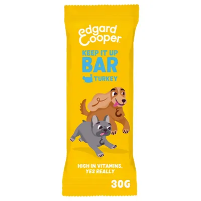 Edgard Cooper Keep It Up Bar Turkey, 30g. High in vitamins, yes really. Gele verpakking met illustraties van twee honden.