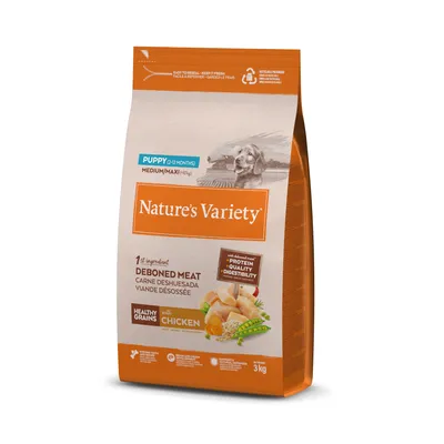 Sac de croquettes Nature’s Variety Puppy (2–12 months) Medium/Maxi, 1er ingrédient viande désossée, céréales complètes, au poulet, 3 kg. Texte en anglais et espagnol visible.