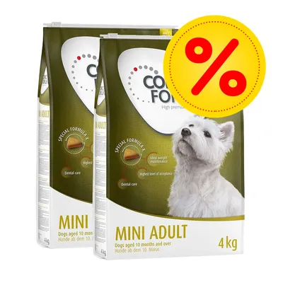 Två påsar hundfoder MINI ADULT 4 kg, synlig text: 'Dogs aged 10 months and over', stor gul rabattikon med röd procenttecken överst till höger.