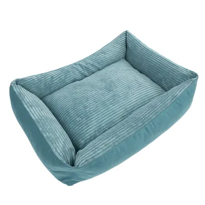 Panier rectangulaire en tissu côtelé bleu, bords surélevés et coussin intégré, sans marque visible.