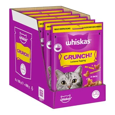 Whiskas Crunch! Leckeres Topping, verpakking met 6 zakjes van elk 100 g. Tekst: 'Mit Huhn, Truthahn & Ente', 'Neue Verpackung, gleicher Geschmack'. Paarse doos met kattenafbeelding. Whiskas Crunch! Leckeres Topping, verpakking met 6 zakjes van elk 100 g. Tekst: 'Mit Huhn, Truthahn & Ente', 'Neue Verpackung, gleicher Geschmack'. Paarse doos met kattenafbeelding.