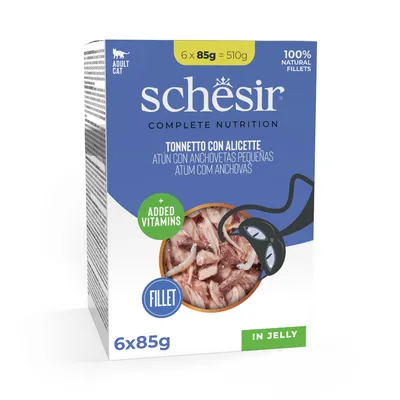 Boîte Schesir Complete Nutrition pour chat adulte, 6 x 85 g, filets naturels de thon avec anchois, vitamines ajoutées, en gelée. Texte multilingue sur l'emballage.