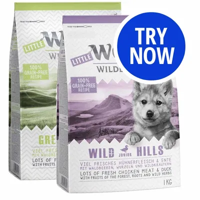 Two bags of pet food with labels showing 100% grain-free recipe, one labelled Wild Hills with fresh chicken meat and duck, fruits of the forest, roots and wild herbs. Blue circle says Try Now.