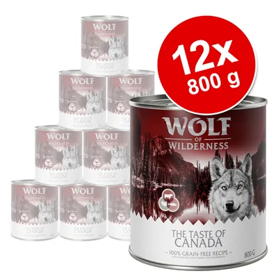 Wolf of Wilderness The Taste of Canada, 12 puszek po 800 g. Widoczny wilk i krajobraz na etykiecie, napis: 100% grain-free recipe, with fresh red, cod, turkey and cranberries.