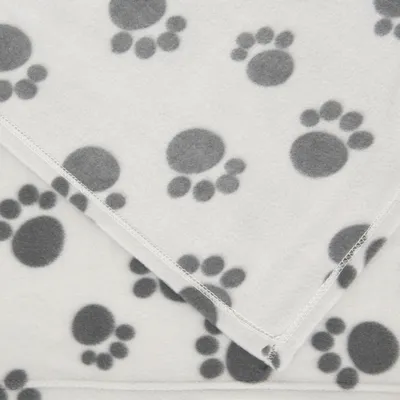 White fleece blanket with grey paw prints, visible seams on the edges.