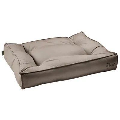 Panier pour chien beige avec côtés rembourrés et logo 'Hunter' sur le devant.