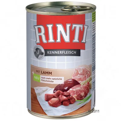 RINTI Kennerfleisch mit Lamm, scritta 'neu noch mehr natürliche Fleischstücke', immagine di carne e fegato su carta da forno sulla confezione.