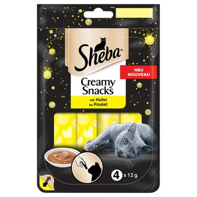 Sheba Creamy Snacks mit Huhn au Poulet, NEU NOUVEAU, 4 x 12 g. Billede af kat og skål med creme. Illustration af hånd der fodrer kat direkte fra pose.