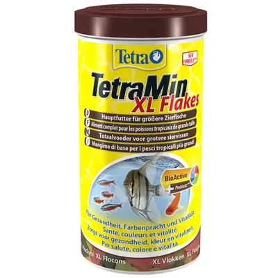 TetraMin XL Flakes fiskfoderburk med text: Hauptfutter für größere Zierfische, BioActive + Prebiotic, för hälsa, färgprakt och vitalitet. Bild på akvariefiskar.