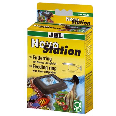 Embalagem JBL Novo Station, anel de alimentação para aquários com adaptação de nível. Texto visível: Feeding ring with level-adaptation. Imagem do produto e peixes tropicais.