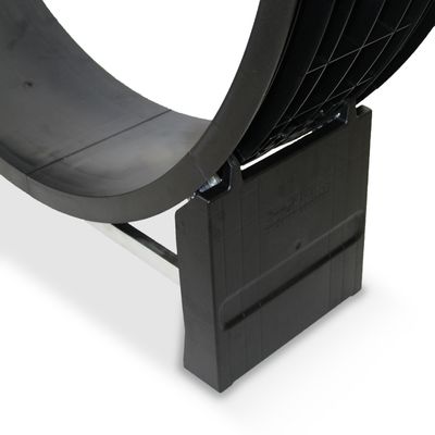 Close-up of a black plastic exercise wheel with metal support, showing part of the base and curved running surface. Brand text 'CaroCat' visible on the base.