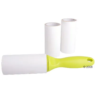 Lint roller with green handle and two spare adhesive paper rolls, all shown on a white background. No visible brand or text.