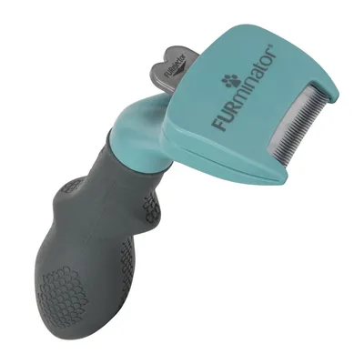 FURminator grooming tool with ergonomic handle and stainless steel blade, suitable for removing loose fur.