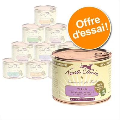 Lot de boîtes Terra Canis pour chien, variantes visibles : Wild, Huhn, Lamm, Dute, Kaninchen. Texte sur l’image : Offre d’essai ! Glutenfrei, 100 % naturel, qualité alimentaire.