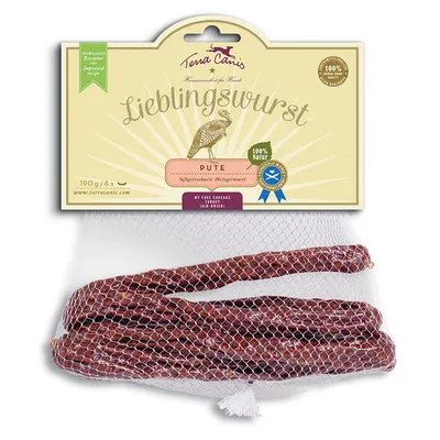 Колбаски Terra Canis Lieblingswurst Pute, 190 г, 8 шт., в сетке. На упаковке: 100 % Natur, улучшенный рецепт, изображение индейки, сайт www.terracanis.com.