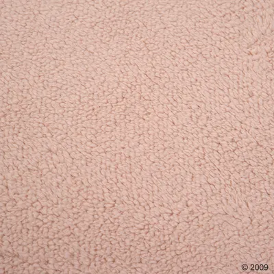 Close-up of a pink, textured fabric material with a soft surface.