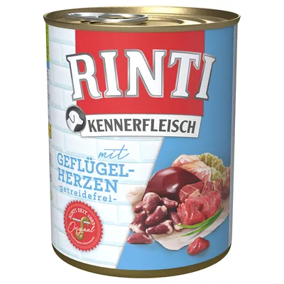 Konzerva Rinti Kennerfleisch mit Geflügelherzen, getreidefrei. Na embalaži so vidni koščki mesa in organov. Besedilo je v nemškem jeziku.