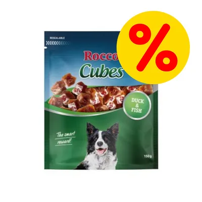 Rocco Cubes DUCK & FISH 150 g, billede af produktpakke med hund og procenttegn for tilbud. Tekst: The smart reward! Resealable.