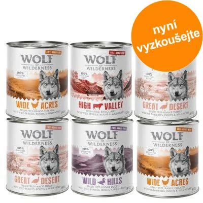 Konzervy Wolf of Wilderness: Wide Acres, High Valley, Great Desert, Wild Hills. Oranžový kruh s textem 'nyní vyzkoušejte'. Konzervy Wolf of Wilderness: Wide Acres, High Valley, Great Desert, Wild Hills. Oranžový kruh s textem 'nyní vyzkoušejte'.