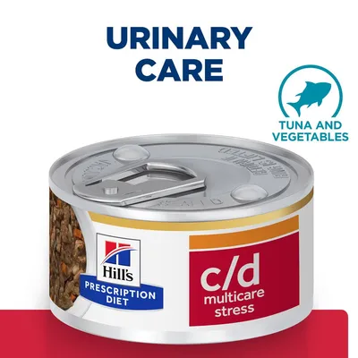 Hill's Prescription Diet c/d multicare stress konzerv, Urinary Care felirattal, Tuna and Vegetables szöveggel és hal szimbólummal a címkén. Hill's Prescription Diet c/d multicare stress konzerv, Urinary Care felirattal, Tuna and Vegetables szöveggel és hal szimbólummal a címkén.