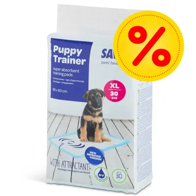 Confezione Puppy Trainer super absorbent training pads, XL 30 pezzi, 90 x 60 cm, con immagine di cucciolo e simbolo percentuale per offerta.