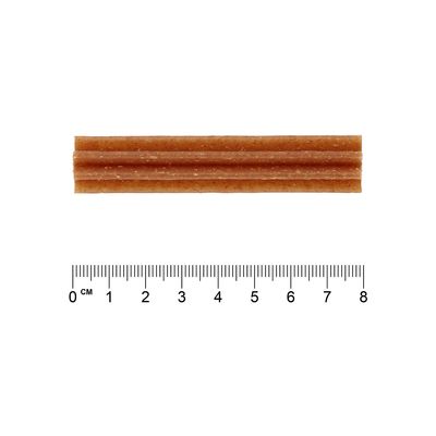 Ein brauner Kausnack mit gerillter Oberfläche, Länge ca. 7 cm, dargestellt neben einem Lineal zur Grössenangabe.