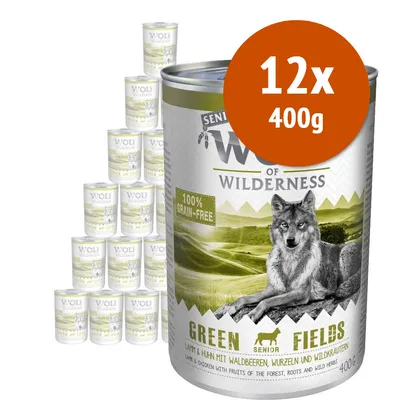 Wolf of Wilderness Senior Green Fields, 12x400g, 100% grain-free. Lattina con immagine di lupo e testo: 'Lamm & Huhn mit Waldbeeren, Wurzeln und Wildkräutern'.
