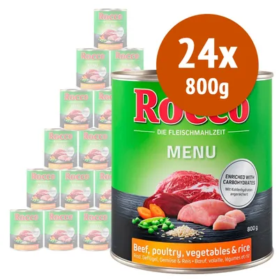 24 lattine da 800 g di Rocco Menu, carne, pollame, verdure e riso. Testo visibile: 'Enriched with carbohydrates', 'Beef, poultry, vegetables & rice'. Immagine di ingredienti sulla confezione.