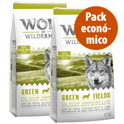 Wolf of Wilderness Green Fields, pack económico de 2 sacos de 12 kg. Receita 100% grain-free. Texto visível: lots of fresh chicken meat & lamb with fruits of the forest, roots and wild herbs.
