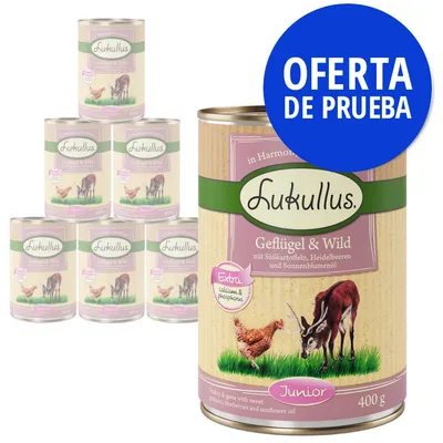 Pack de 6 latas Lukullus Geflügel & Wild Junior 400 g. Texto visible: 'Extra calcium & phosphorus'. Etiqueta azul: OFERTA DE PRUEBA.