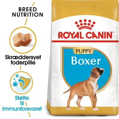 Royal Canin Puppy Boxer tørfoder, tekst: BREED NUTRITION, Skræddersyet foderpille, Støtte til immunforsvaret. Billede af foderpille og hundehvalp på posen.