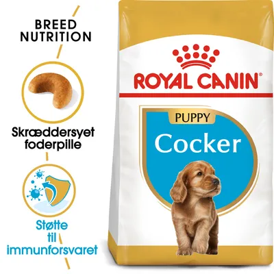 ROYAL CANIN PUPPY Cocker tørfoderpose, tekst: Breed Nutrition, Skræddersyet foderpille, Støtte til immunforsvaret. Billede af foderpille og hund.