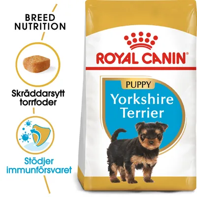 Royal Canin Puppy Yorkshire Terrier torrfoder. Text: Skräddarsytt torrfoder, Stödjer immunförsvaret, Breed Nutrition. Bild på en valp och ett foderbit.
