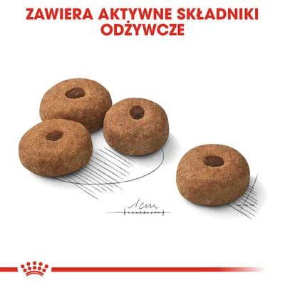 Cztery okrągłe granulki karmy o średnicy około 1 cm, tekst: ZAWIERA AKTYWNE SKŁADNIKI ODŻYWCZE. Widoczna miarka długości.