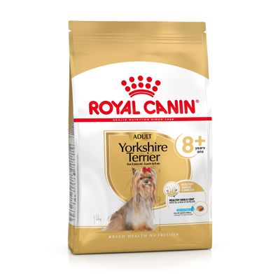 Pungă Royal Canin Adult Yorkshire Terrier 8+ ani, imagine cu un câine Yorkshire Terrier și text: Healthy Ageing Complex, Healthy Skin & Coat, crochetă adaptată. Greutate 1 kg.