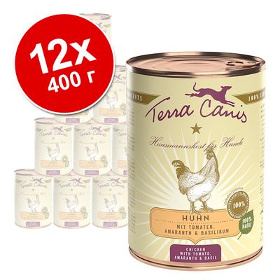 Набор из 12 консервов Terra Canis Huhn по 400 г. На банке: курица, с томатами, амарантом и базиликом. Видны надписи на немецком и английском языках.