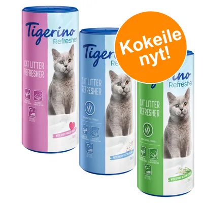 Tigerino Refresher Cat Litter Refresher -tuotteet: baby powder, fresh cotton ja spring meadow. Teksti oranssissa ympyrässä: Kokeile nyt!