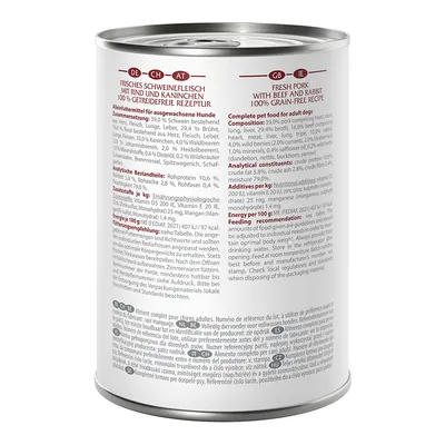 Tin labelled: Fresh pork with beef and rabbit, 100% grain-free recipe. Composition, analytical constituents and feeding recommendation for dogs visible.