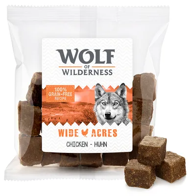 Wolf of Wilderness Wide Acres Chicken – Huhn, 100% grain-free recipe, verpakking met zichtbare bruine blokjes hondensnack.