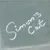 Embroidery with 'Simon's Cat' lettering on grey fabric.