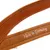 Brown leather product with white lettering 'Made in Germany'.