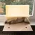 Wooden window perch with beige fabric cover and plush edge, suitable for mounting on window sills.