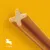 Dog snack in X-shape, suitable for dogs weighing 5-10 kg. Yellow background with dog symbol and weight indication.