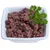 Bowl with red, minced meat and parsley sprig as garnish.