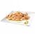 Chunks of cooked meat with visible pieces of vegetables and sauce on a white square plate, small garnish in the corner. No brand or product name visible.