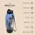 Botella dispensadora Nomad Tales München, color azul y negro, con asa. Texto en inglés: Premium quality, Treat dispenser, Easy to clean, On the go, Multifunction 2 in 1, Hands free, Made with love.