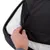 Close-up of an open zip on a black, padded cover with visible inner filling.